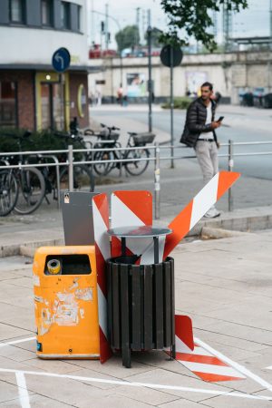 A sculpture made from trash bins, warning signs, and cleaning materials forms part of the participatory stations at the Hammer Caretaker Championships.